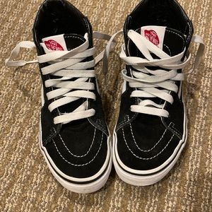 Kids Black/white suede and fabric high top sneakers.